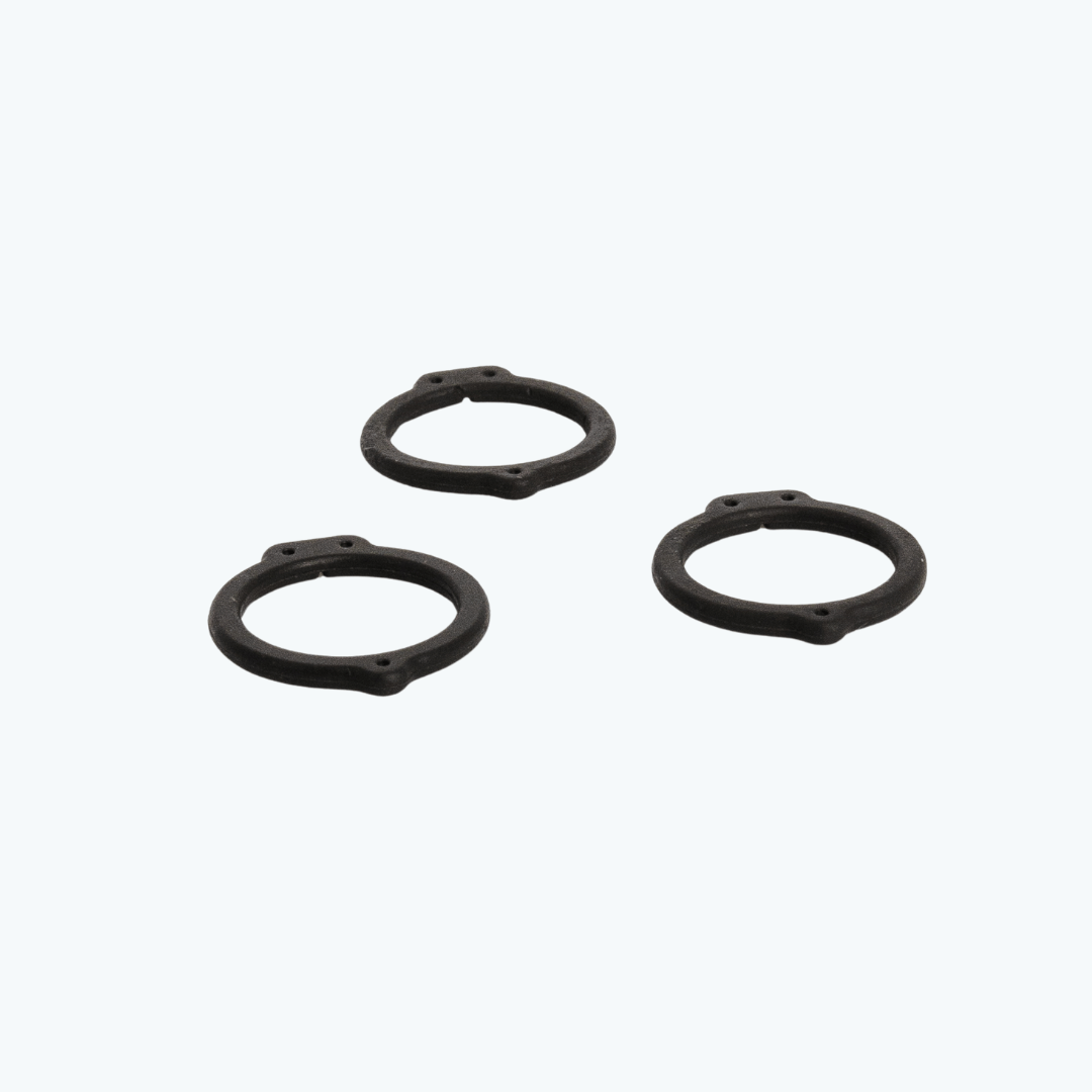 Close-up of three Genesee BioMedical silicone coronary graft markers for cardiac bypass and revascularization procedures.